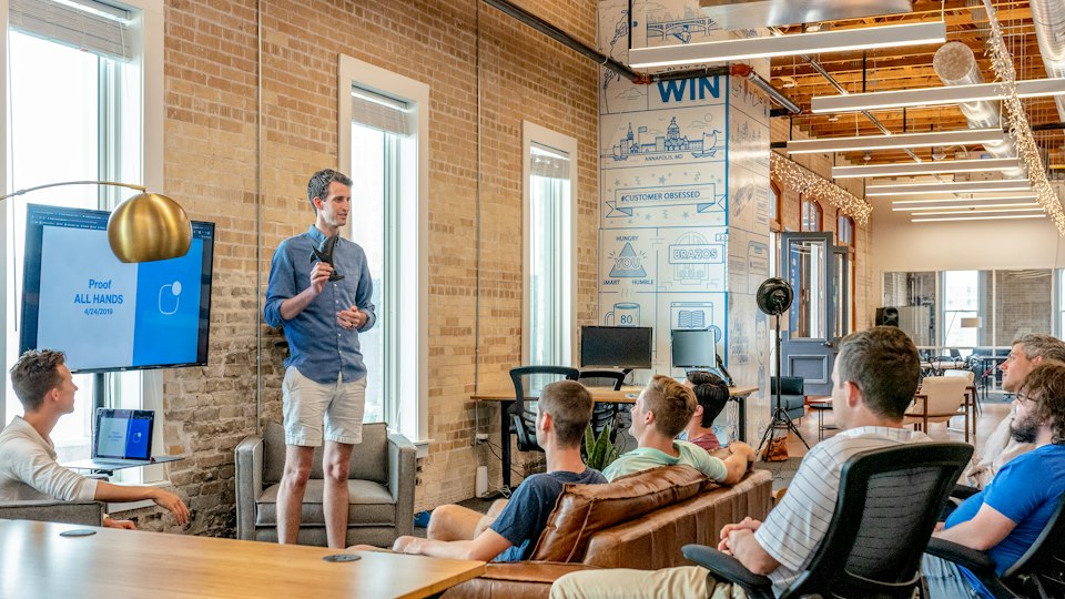 Brand team collaborating in a modern workspace